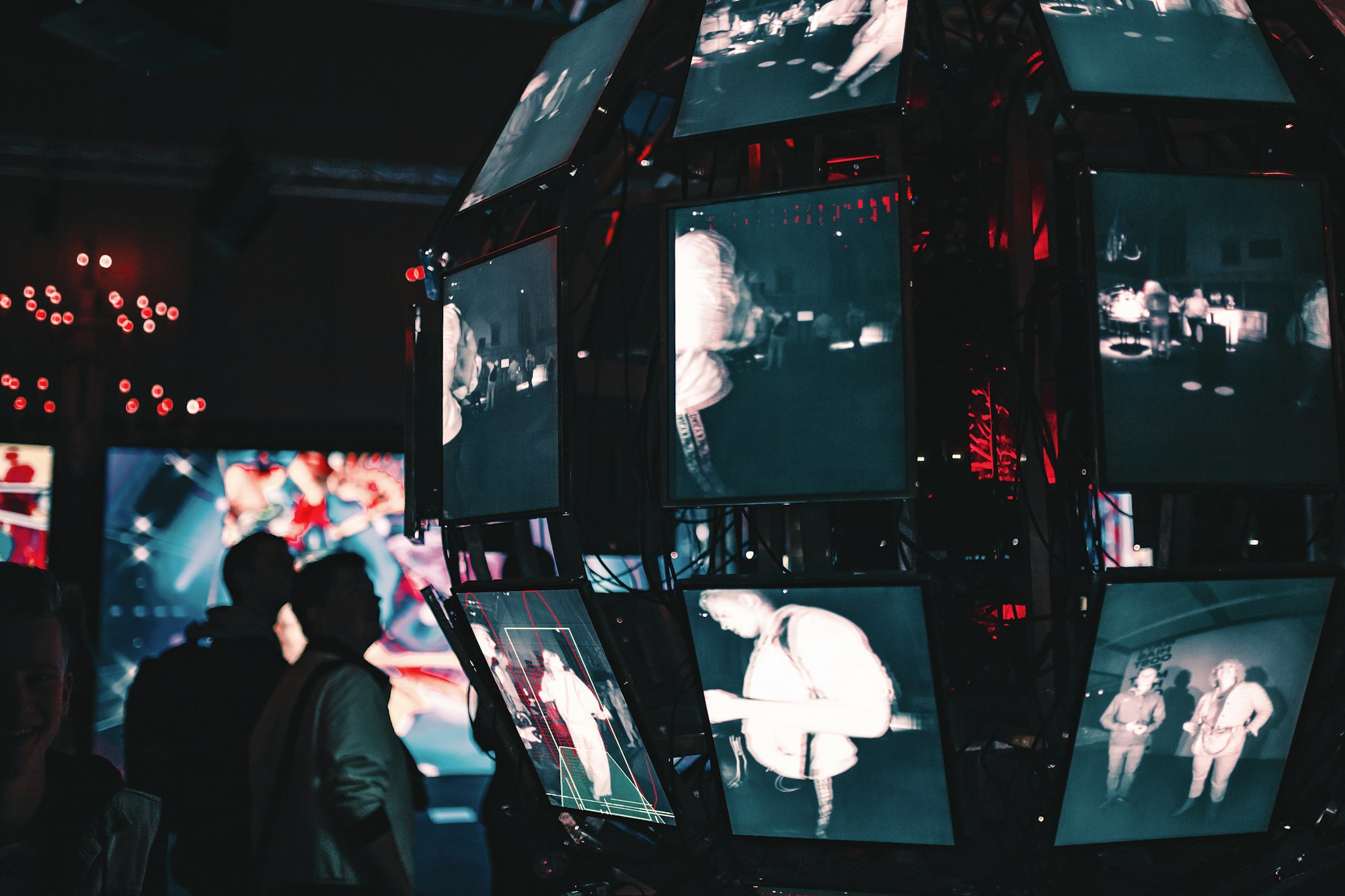 AI-powered security surveillance control room with multiple monitors displaying video analytics and threat detection systems